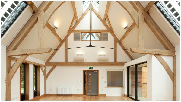 Exposed roof truss detail showing steel bottom chord & king post, creating a modern and light-weight look
