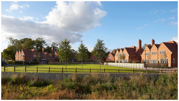 North-westerly view of the Wood Farm development of Arts & Crafts inspired cluster of detached cottage style houses and their landscaping